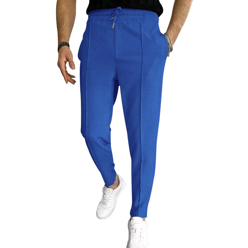 Men's tapered jogging chinos made of structured woven quality with elastic drawstring waistband and decorative crease Mune Fashion