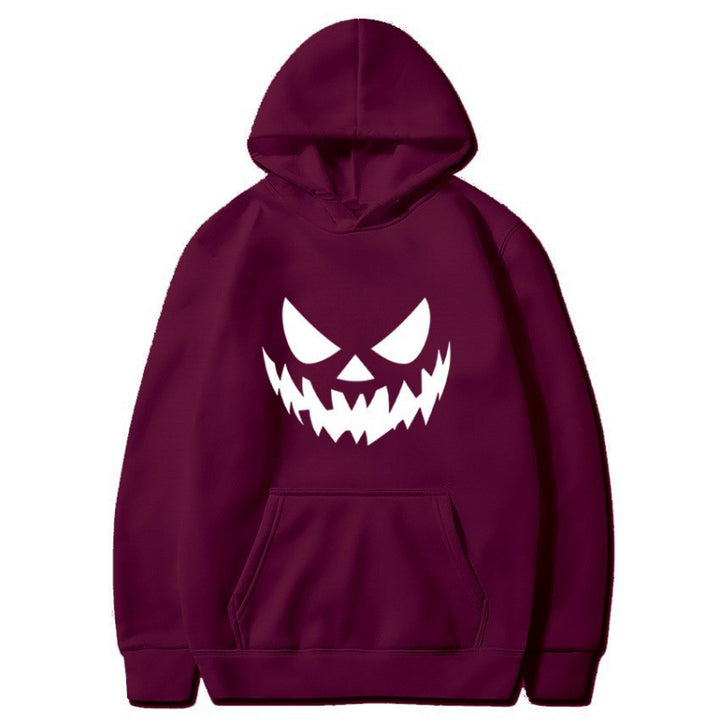Unisex hooded sweatshirt with creepy pumpkin face print and oversized kangaroo pocket Mune Fashion
