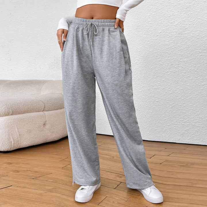 Women's wide sweatpants with elastic waistband, drawstring and adjustable hem.
