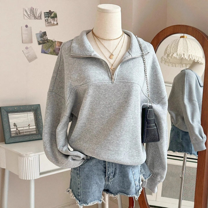 Women's oversized sweatshirt with half zipper, high collar and balloon sleeves Mune Fashion