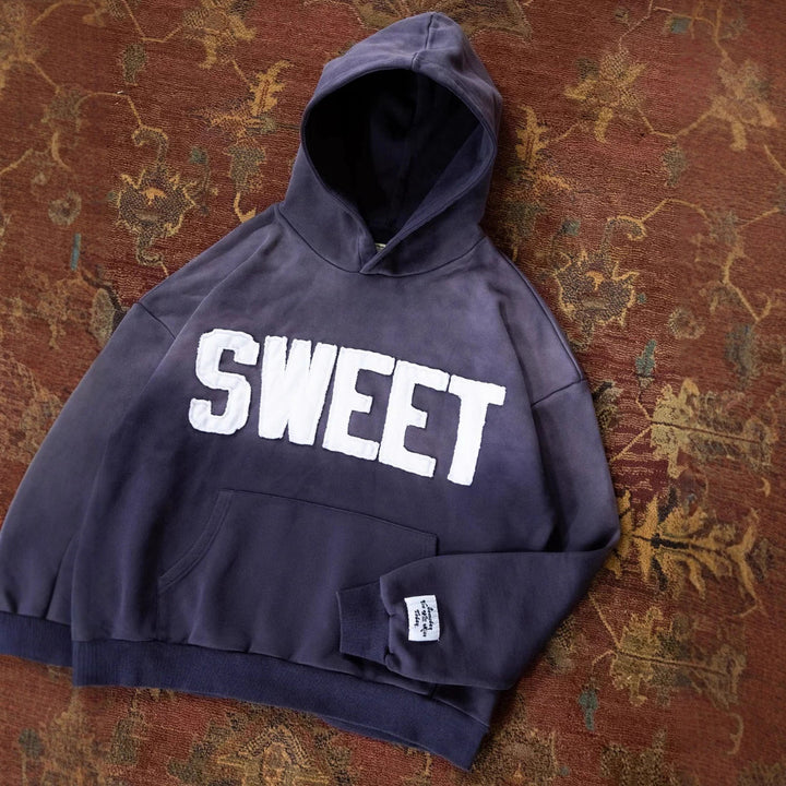Unisex nan oversized hoodie with appliquéd letter patches and kangaroo pocket Mune Fashion