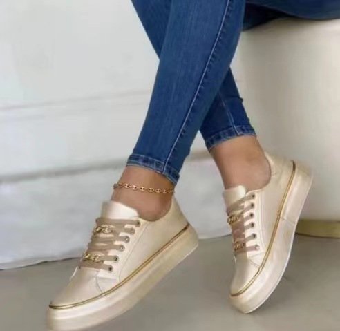 Women's platform sneaker with gold decorative edging and jewelry chain details Mune Fashion