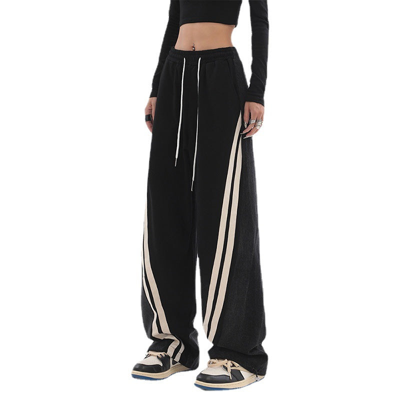 Ladies wide jogging pants with high waist and denim inserts as well as side stripes Mune Fashion