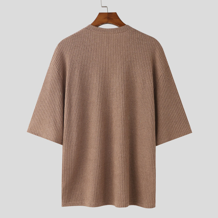 Women's oversized V-neck knit top with textured ribbed look and half-length sleeves Mune Fashion