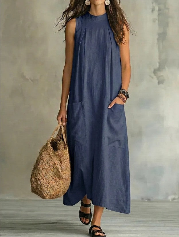Women’s sleeveless linen maxi dress with standing collar, pleats at the chest, and piled pockets Mune Fashion