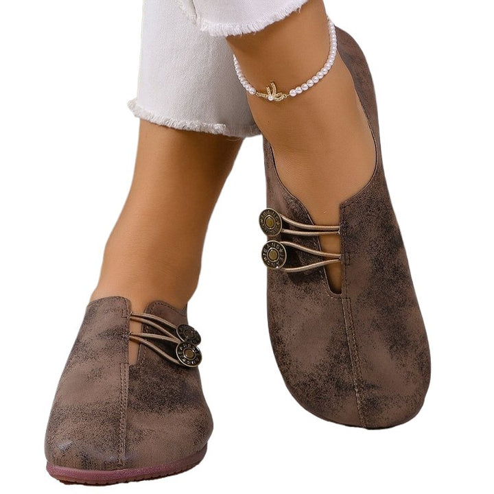 Ladies nan elegant comfort slipper in moccasin style with elastic decorative cord and button detail Mune Fashion