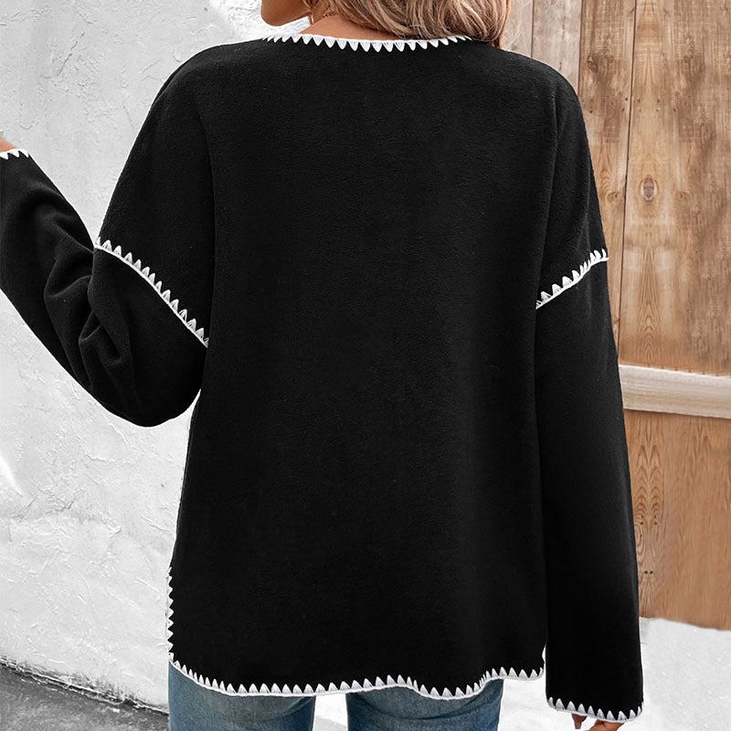 Women's oversized cardigan with contrasting decorative seams, patch pockets and button placket Mune Fashion