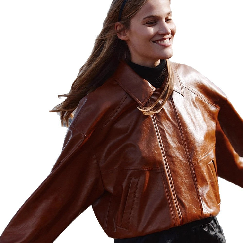 Women's short blazer made of vegan smooth leather with boxy silhouette and concealed snap button placket Mune Fashion