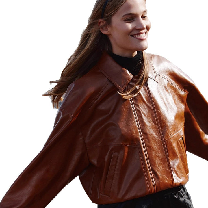 Women's short blazer made of vegan smooth leather with boxy silhouette and concealed snap button placket Mune Fashion