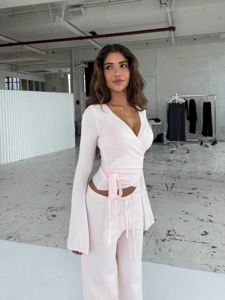 Women's knitted wrap top with tie belt and trumpet sleeves, as well as high-waisted wide-cut knitted pants Mune Fashion