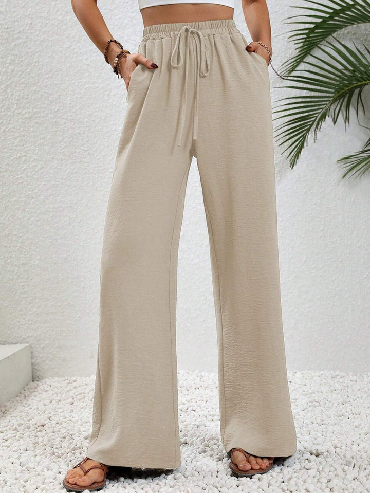 Ladies lightweight, loose-fitting beach pants with elastic waistband, drawstring and side pockets Mune Fashion