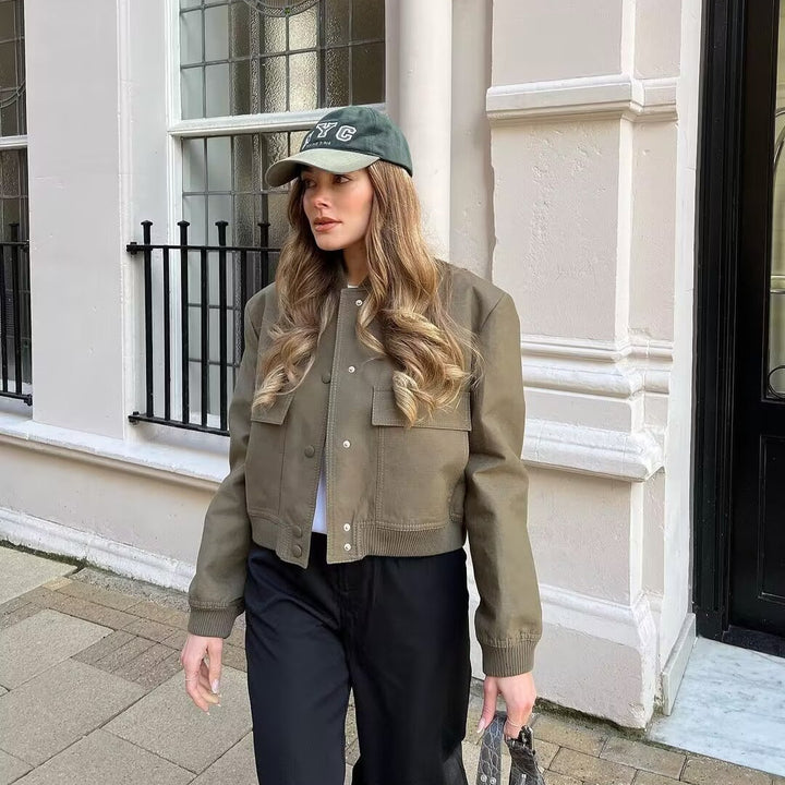 Women’s short-cut faux leather bomber jacket with patch flap pockets and ribbed hems Mune Fashion