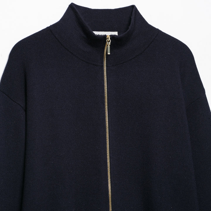Women's cropped fine-knit cardigan with standing collar, full-length zipper, and fitted ribbed section.