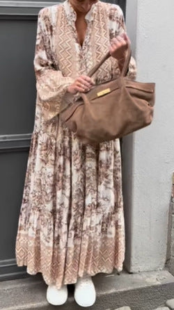 Ladies' tiered maxi dress with ethnic border, stand-up collar, and wide bell sleeves Mune Fashion