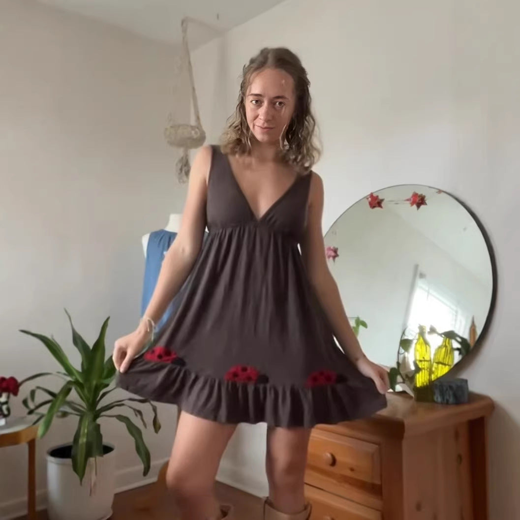 Women's sleeveless mini dress with deep V-neck underbust seam and ruffle hem with ladybug appliqué Mune Fashion