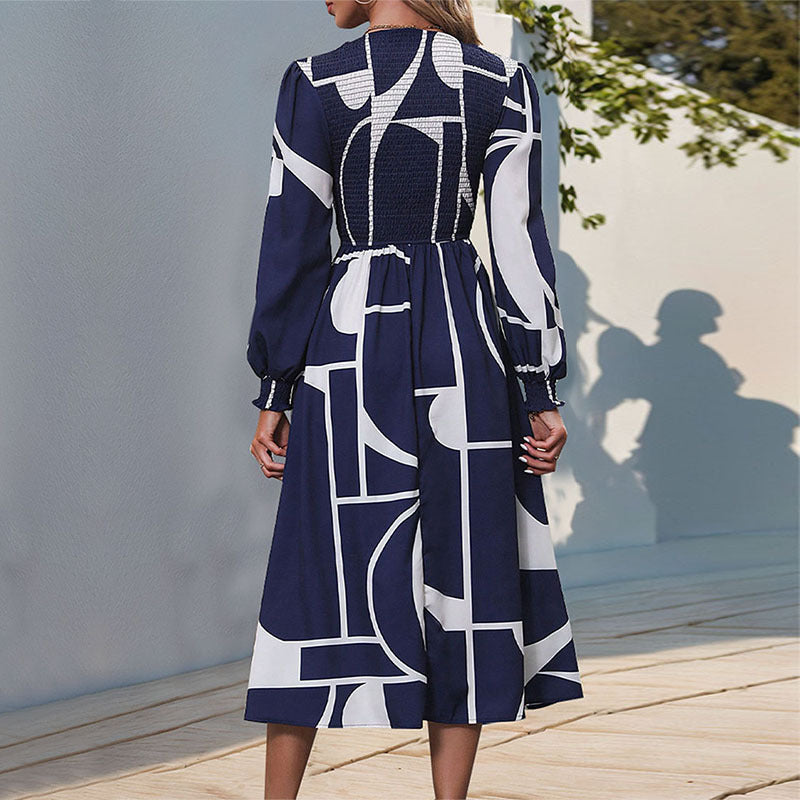 Women's A-line midi dress with smocked bustier, long balloon sleeves, and graphic print Mune Fashion