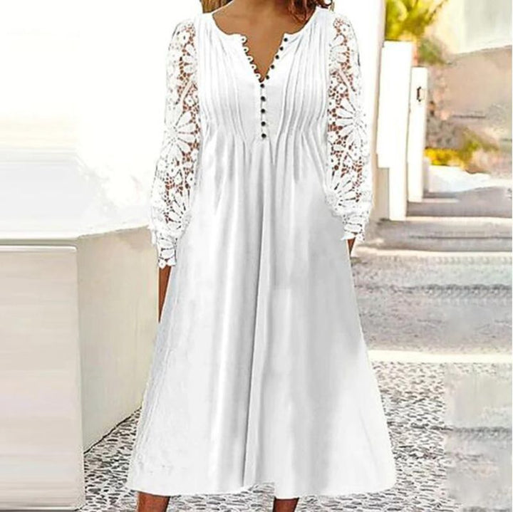 Ladies' knee-length A-line summer dress with crocheted long sleeves, pleated bodice and decorative button placket Mune Fashion