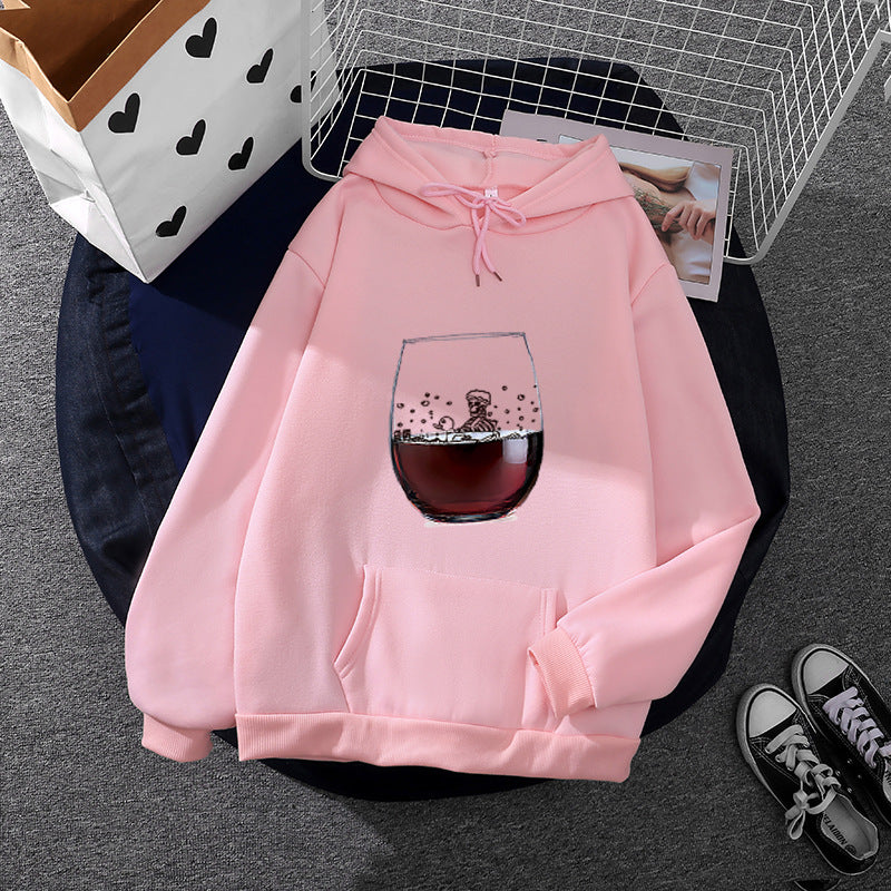 Women’s casual hoodie with photorealistic wine glass graphic, kangaroo pocket, and soft fleece Mune Fashion