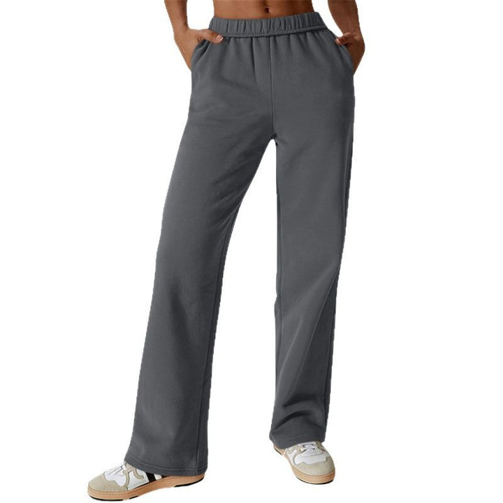 Women's high-cut loose jogging pants made of soft sweat fabric with elastic waistband and side pockets Mune Fashion