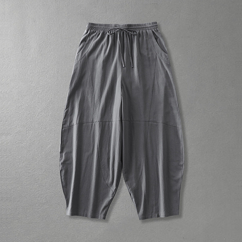 Women's wide harem pants made of lightweight satin with drawstring and side pockets Mune Fashion