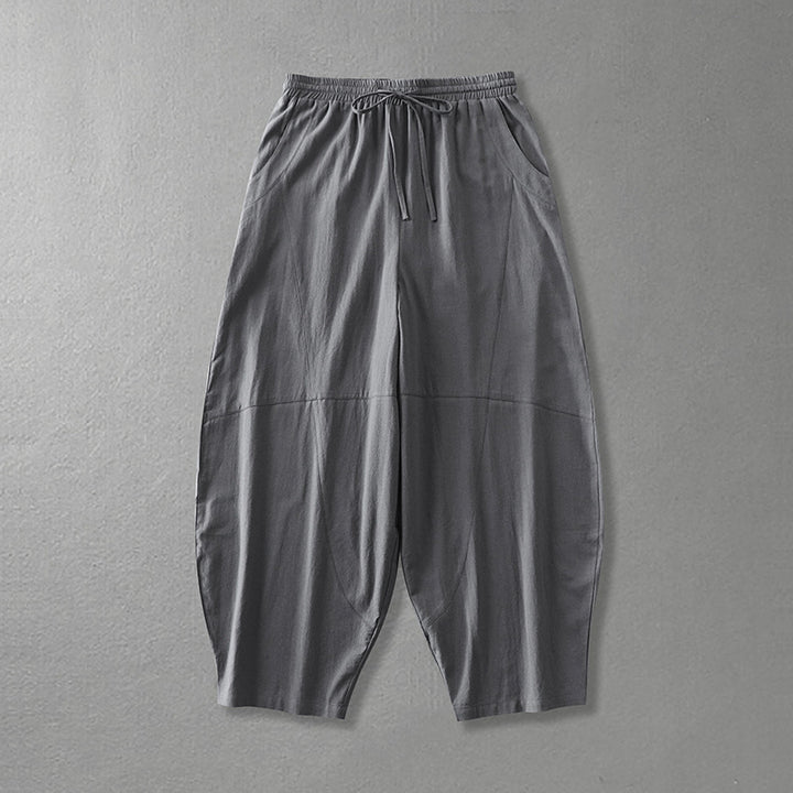 Women's wide harem pants made of lightweight satin with drawstring and side pockets Mune Fashion