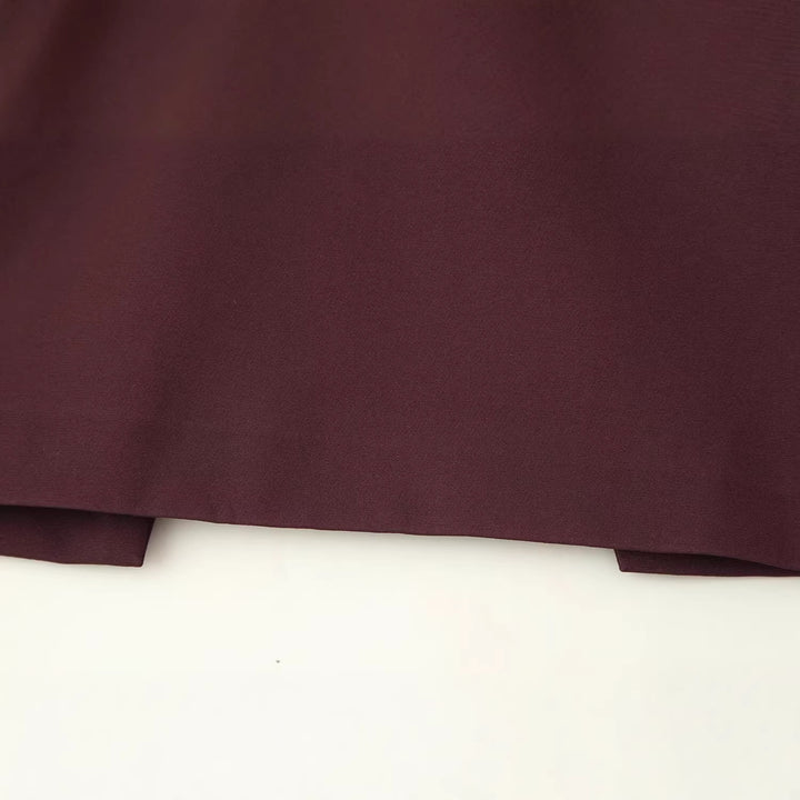 Women’s top with capelet overlay and fitted peplum silhouette Mune Fashion