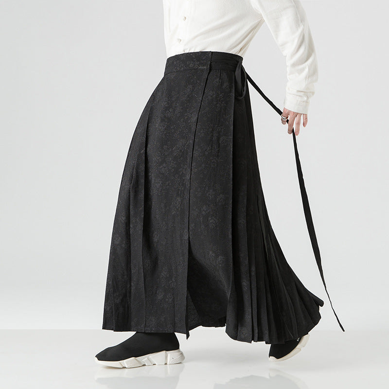 Women's maxi skirt with wide waistband, ornamental border and pleated folds Mune Fashion