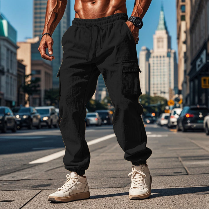 Men's sporty work-inspired joggers with patch flap pockets, elastic drawstring waistband, and gathered leg cuffs Mune Fashion