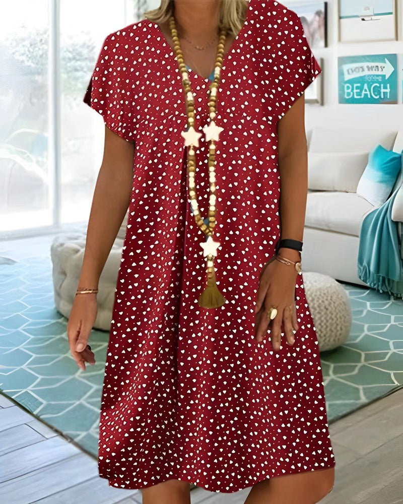 Ladies nan locker falling V-neck short dress with A-line cut, cap sleeves and all-over heart print Mune Fashion