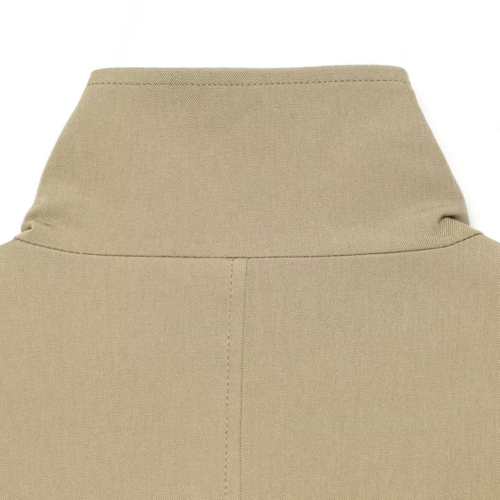 Women's short trench coat in lightweight gabardine style with asymmetrical button closure and tie belt Mune Fashion
