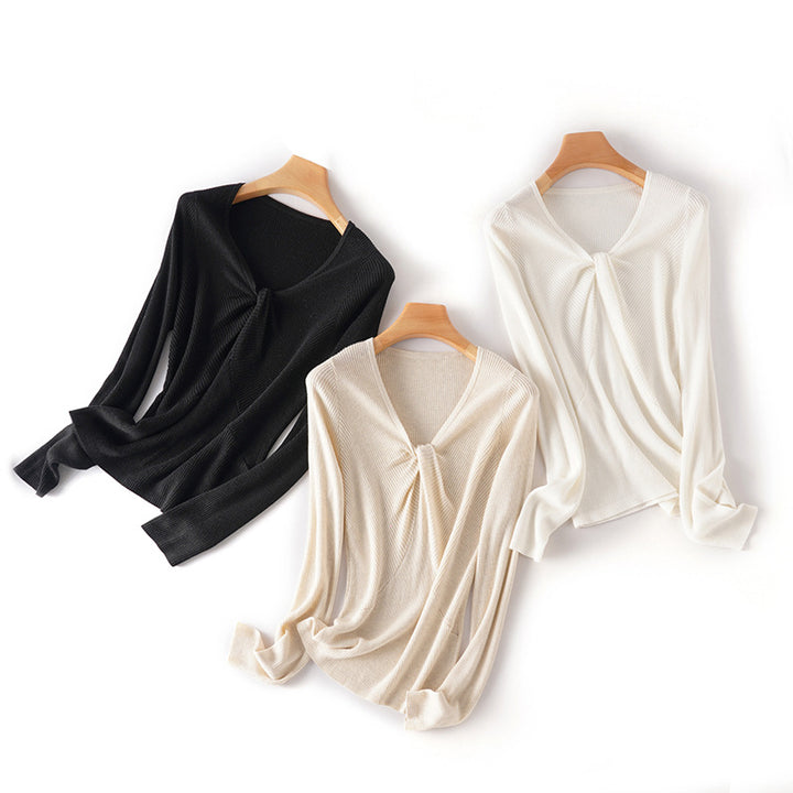 Women's fine-knit top with V-neck, twist detail, and fitted silhouette Mune Fashion