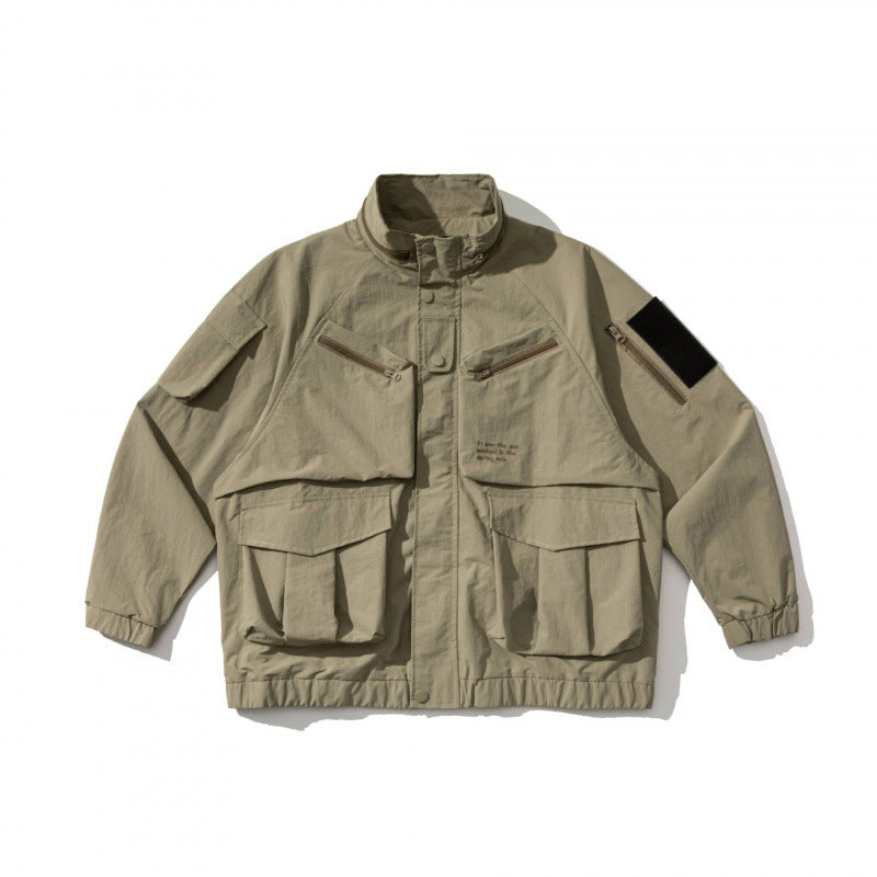 Unisex Oversize Utility Jacket with multifunctional pockets, high stand-up collar, and elastic hem Mune Fashion