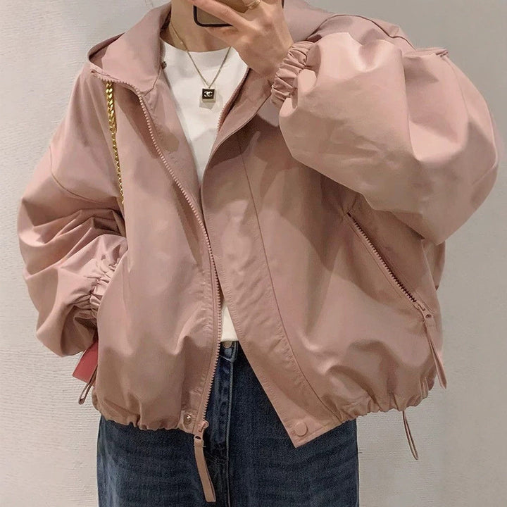 Women's oversized bomber-style hooded jacket with drawstring, elastic cuffs, and side zip pockets Mune Fashion