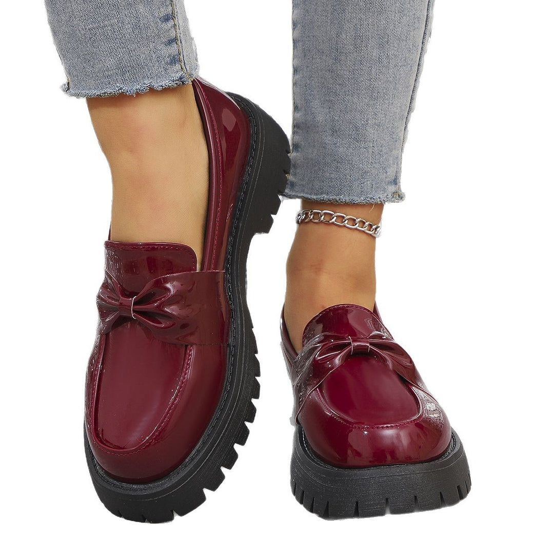 Women’s shiny platform loafers with oversized bow appliqué and profiled rubber sole Mune Fashion