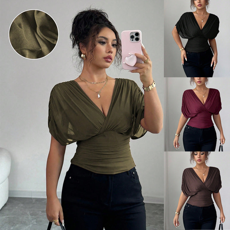 Women's fitted wrap top with deep V-neck and gathered wing sleeves Mune Fashion
