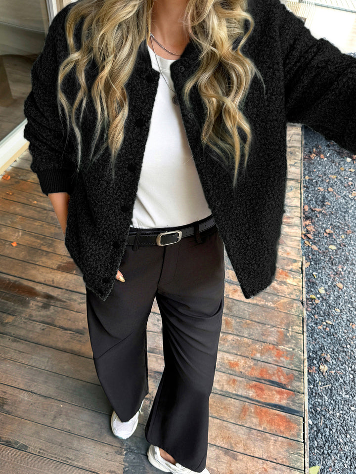 Women's short satin trench coat with double-breasted button placket, patch pockets, and buttoned sleeve cuffs Mune Fashion