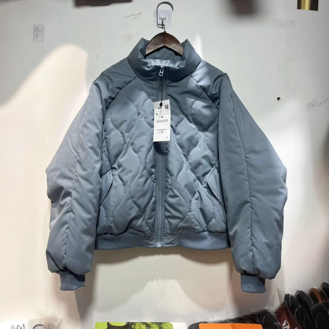 Women's quilted bomber jacket with high stand-up collar, lightweight thermal padding, and ribbed cuffs Mune Fashion