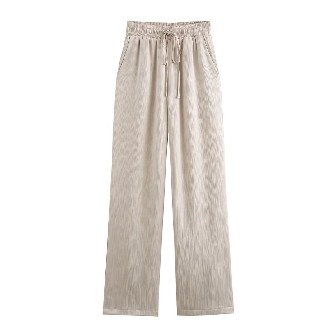 Women's pleated high-waist palazzo pants with elastic waistband, drawstring, and side pockets Mune Fashion
