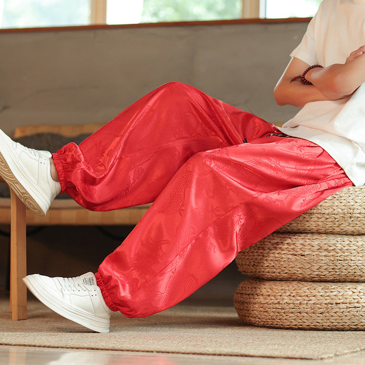 Men's wide Jacquard satin harem pants with drawstring, elastic cuffs, and traditional dragon motif Mune Fashion