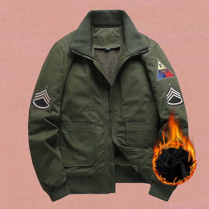 Men's military-inspired bomber jacket with applied patches, concealed zipper, and elastic cuffs.