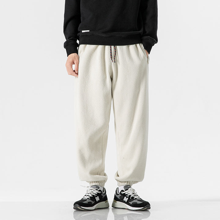 Men's wide-cut fleece jogging pants with elastic cuffs and side pockets Mune Fashion