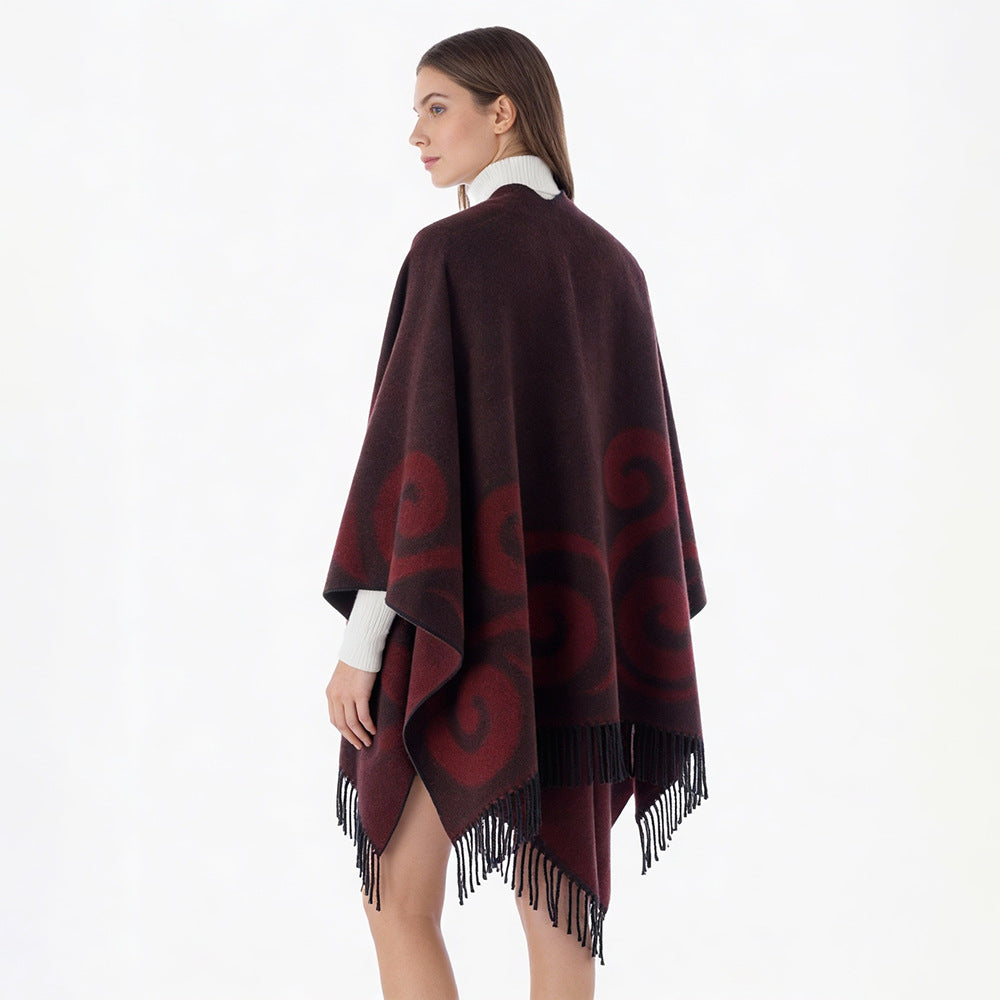 Women's wool blend poncho with jacquard swirl pattern, V-neck and fringes