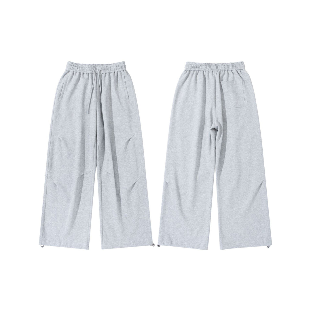Unisex Wide French-Terry Sweatpants with elastic drawstring waistband, side pockets, and adjustable hem.