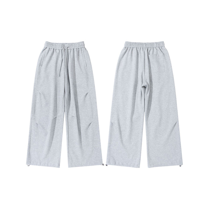 Unisex Wide French-Terry Sweatpants with elastic drawstring waistband, side pockets, and adjustable hem.