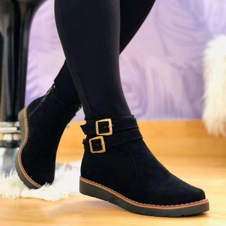Women's faux suede ankle boot with double decorative buckle, side zipper, and slip-resistant profile sole Mune Fashion