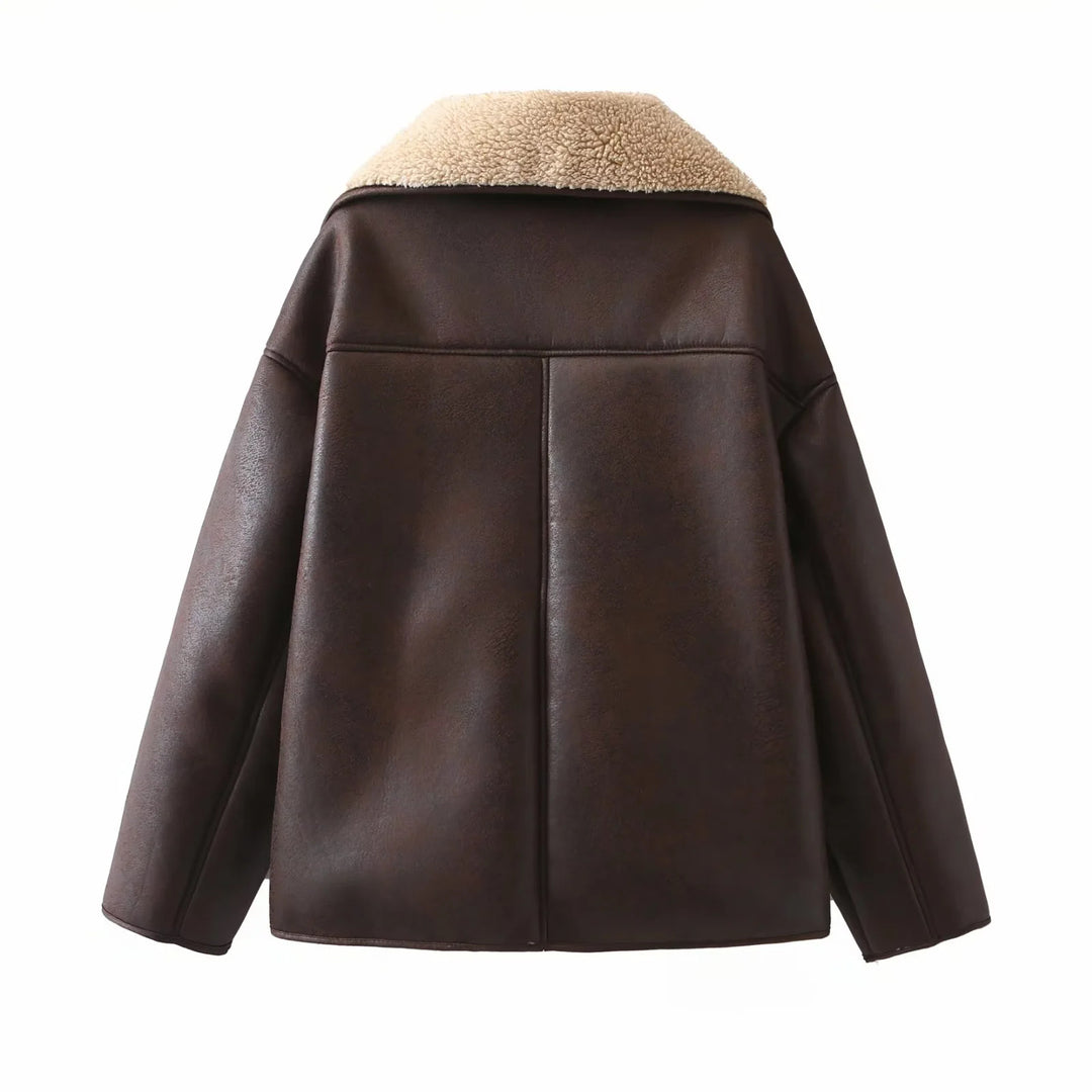 Women's trendy faux leather shearling jacket with large teddy collar, patch front pockets, and button closure Mune Fashion