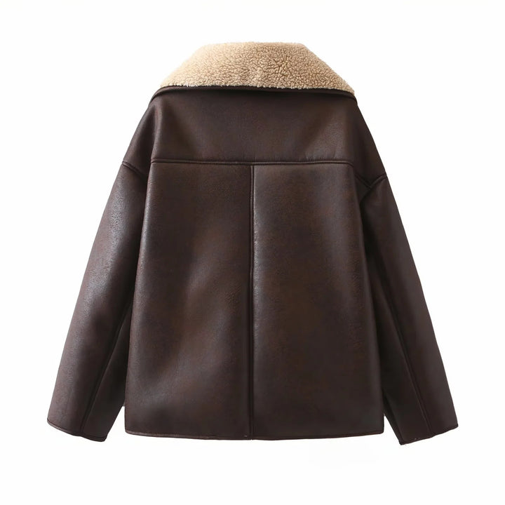 Women's trendy faux leather shearling jacket with large teddy collar, patch front pockets, and button closure Mune Fashion