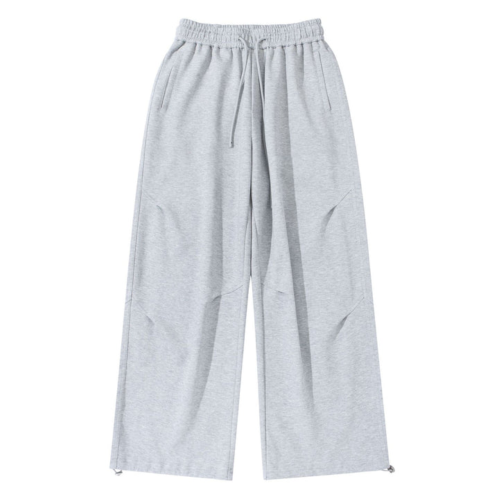 Unisex Wide French-Terry Sweatpants with elastic drawstring waistband, side pockets, and adjustable hem.