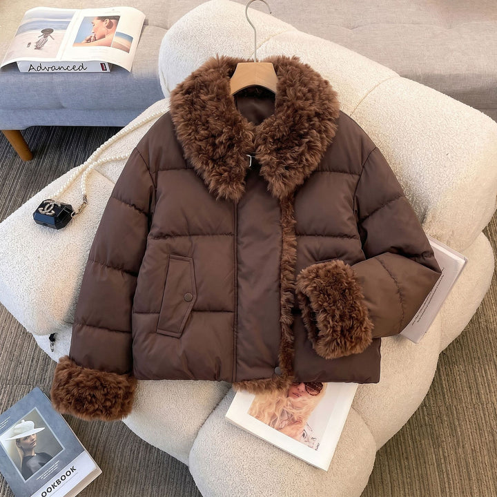 Women's fitted quilted jacket with voluminous teddy collar and detachable pom-pom details Mune Fashion