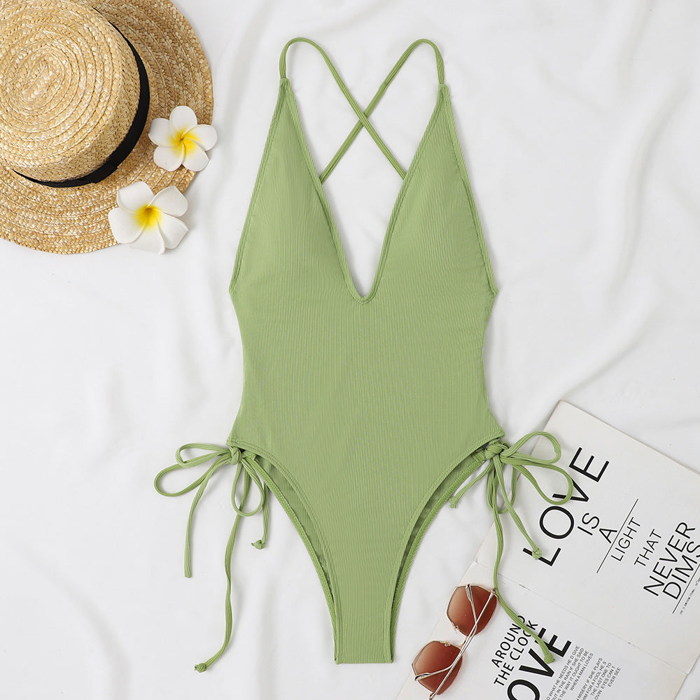 Ladies one-piece swimsuit with deep V-neck and adjustable side ties Mune Fashion